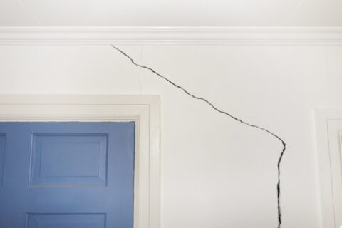 Cracked drywall in a home showing damage from structural movement