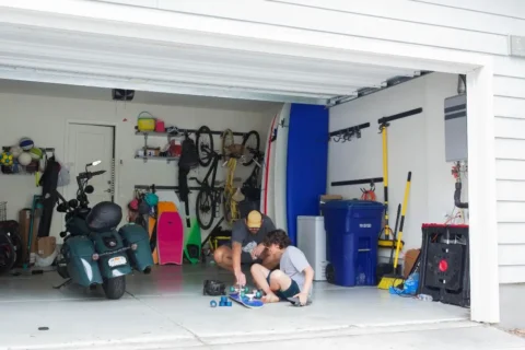 Father and son working in the garage in TX