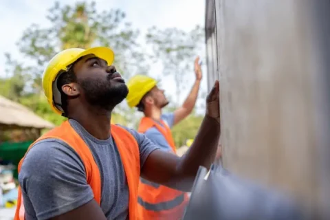 Men lifting a home in Texas